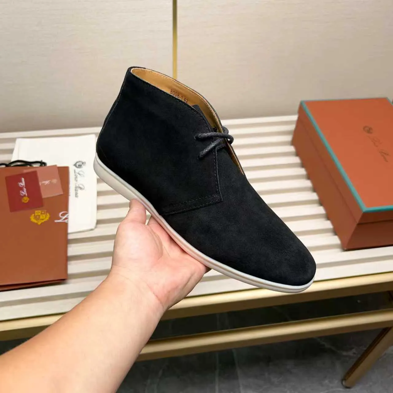 Men's Shoes 💰420 Loro Piana reimagines the desert boot—a modern, comfortable interpretation of a classic 1940s style. Crafted from suede calfskin, it exudes elegance. The tight texture of suede calfskin is not only durable but also looks casual and sophisticated. Add a timeless piece to your shoe collection, harmoniously blending comfort, style and Loro Piana's heritage of craftsmanship. Acetate satin detail on the inside White sole with LP lettering for added traction Space for a personalized signature on the heel Tonal suede trim Upper: 100% cow split suede Sole: 100% Rubber lining: Cow leather
